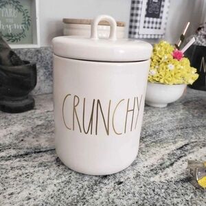 Rae Dunn "Crunchy" Ceramic Canister with white ceramic body with gold lettering